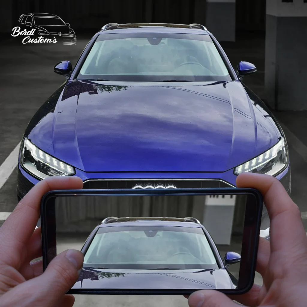 Visuel composé d’une Audi A4 et d’un écran de téléphone
